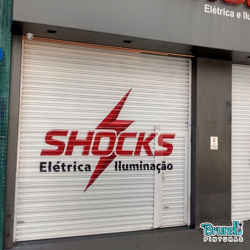 Letreiros em portas de enrolar Shock El�trica