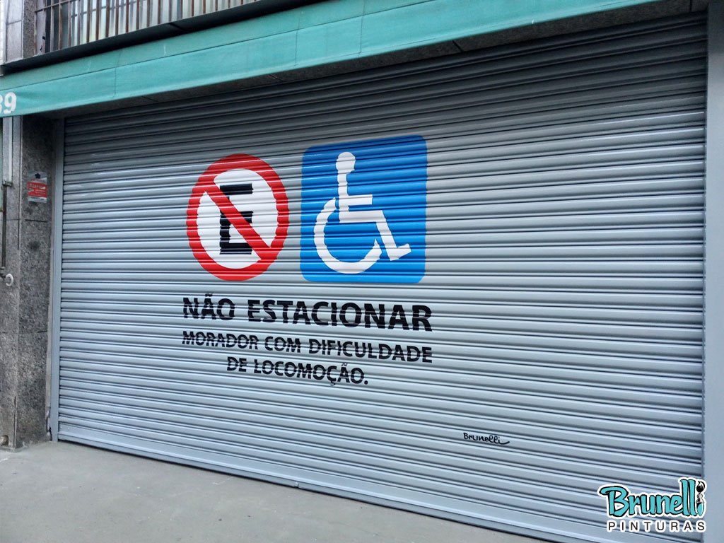 pintura de letreiro em porta de aço proibido estacionar